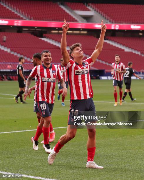 Marcos Llorente of Atletico de Madrid celebrates scoring their fourth goal with teammate Angel Martin Correa during the La Liga Santander match...