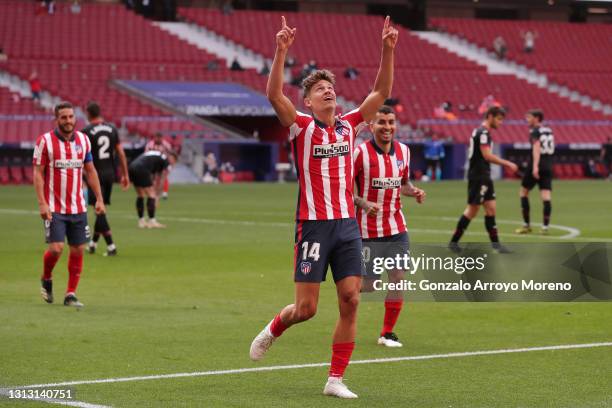 Marcos Llorente of Atletico de Madrid celebrates scoring their fourth goal with teammate Angel Martin Correa during the La Liga Santander match...