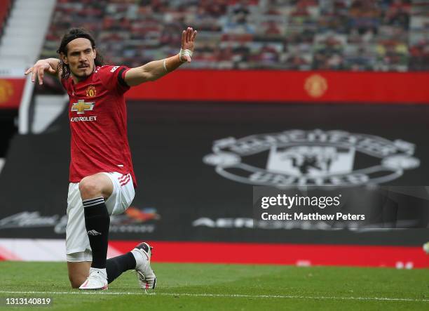 Edinson Cavani of Manchester United celebrates scoring their third goal during the Premier League match between Manchester United and Burnley at Old...