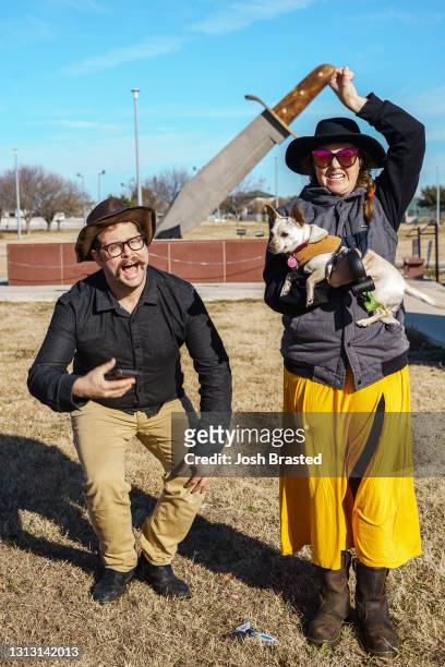 Vanlifers Josh Brasted, and Mary Alice Sandberg pose for a photo in front of the worlds largest Bowie Knife on December 22, 2020 in Bowie, Texas.