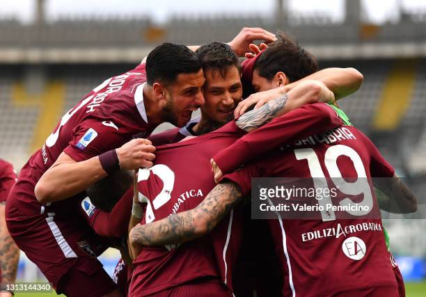 Antonio Sanabria of Torino FC celebrates with teammates after scoring his team's first goal during the Serie A match between Torino FC and AS Roma at...