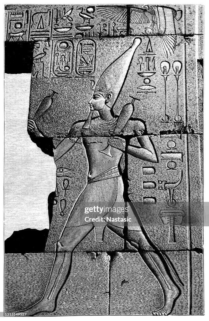 A relief depicting the goddess Isis and Pharaoh Seti I at the Great Hypostyle Hall at the Temple of Amun in Karnak, Luxor, Upper Egypt