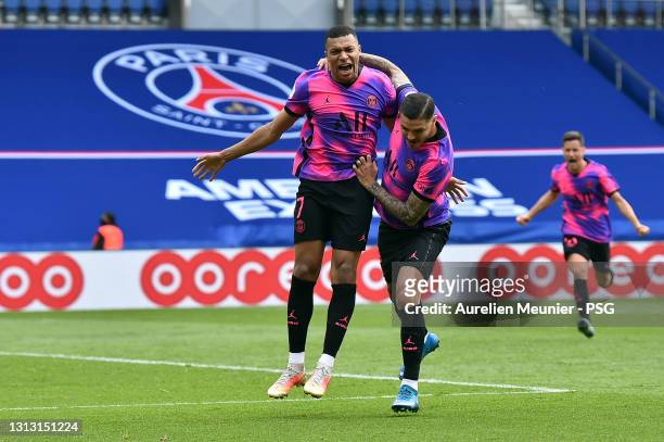 Kylian Mbappe of Paris Saint-Germain is congratulated by teammate Mauro Icardi after scoring during the Ligue 1 match between Paris Saint-Germain and...
