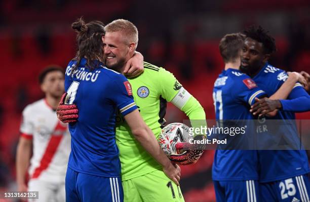 Caglar Soyuncu and Kasper Schmeichel of Leicester City celebrate following their team's victory in the Semi Final of the Emirates FA Cup between...