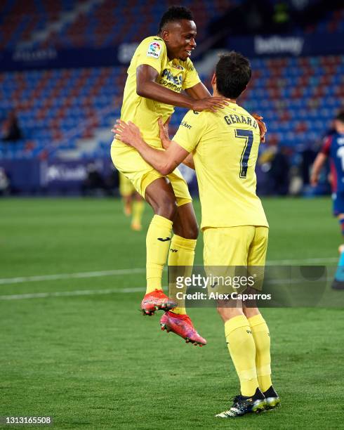 Gerard Moreno of Villarreal CF celebrates with his teammate Samuel Chukwueze after scoring his team's second goal during the La Liga Santander match...