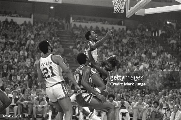 Denver Nuggets guard Ted McClain charges into Cleveland Cavaliers guard Foots Walker during an NBA basketball game at McNichols Arena on December 9,...