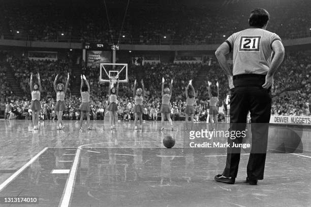 Referee Norm Drucker stands in the key during a timeout in an NBA basketball game between the Denver Nuggets and the Cleveland Cavaliers at McNichols...