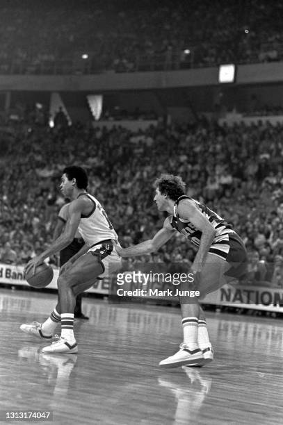 Cleveland Cavaliers guard Dick Snyder checks Denver Nuggets guard Chuck Williams during an NBA basketball game at McNichols Arena on December 9, 1976...