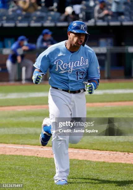 Catcher Salvador Perez of the Kansas City Royals celebrates while trotting up the first base line after hitting a home run in the bottom of the 7th...