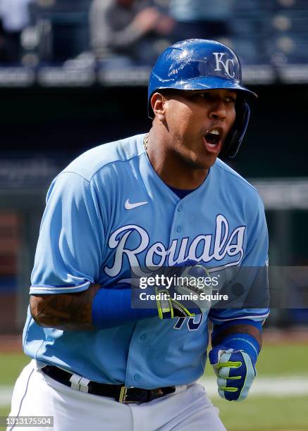 Catcher Salvador Perez of the Kansas City Royals celebrates while trotting up the first base line after hitting a home run in the bottom of the 7th...