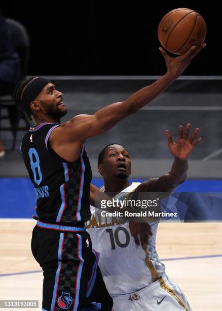 Maurice Harkless of the Sacramento Kings takes a shot against Dorian Finney-Smith of the Dallas Mavericks in the first quarter at American Airlines...
