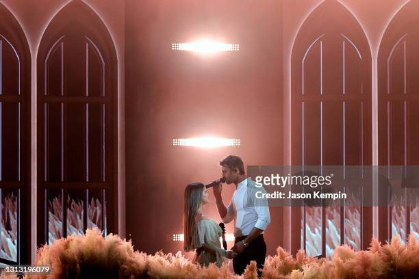 In this image released on April 18, Maren Morris and Ryan Hurd perform onstage at the 56th Academy of Country Music Awards at the Ryman Auditorium on...