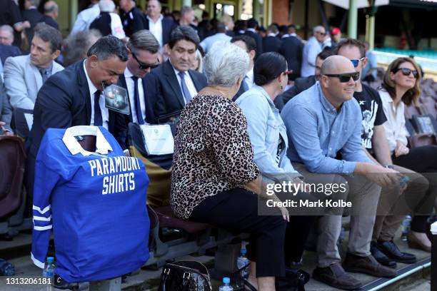 Newtown Jets jersey is seen next to Tommy Raudonikis' wife Trish Brown and other family members during the Tommy Raudonikis Memorial Service at the...