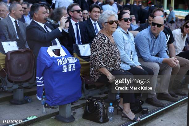Newtown Jets jersey is seen next to Tommy Raudonikis' wife Trish Brown and other family members during the Tommy Raudonikis Memorial Service at the...