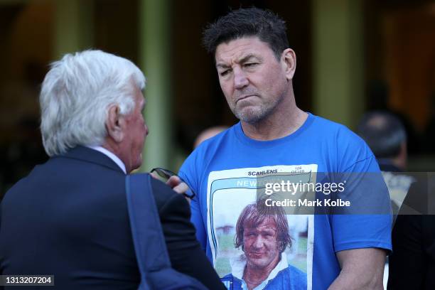 Former rugby league player Mark Carroll looks on as Ray Warren walks past during the Tommy Raudonikis Memorial Service at the Sydney Cricket Ground...