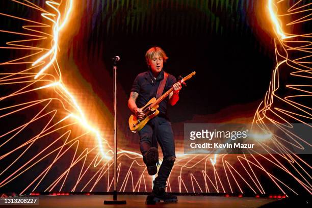 In this image released on April 18, Keith Urban performs onstage at the 56th Academy of Country Music Awards at the Grand Ole Opry on April 18, 2021...
