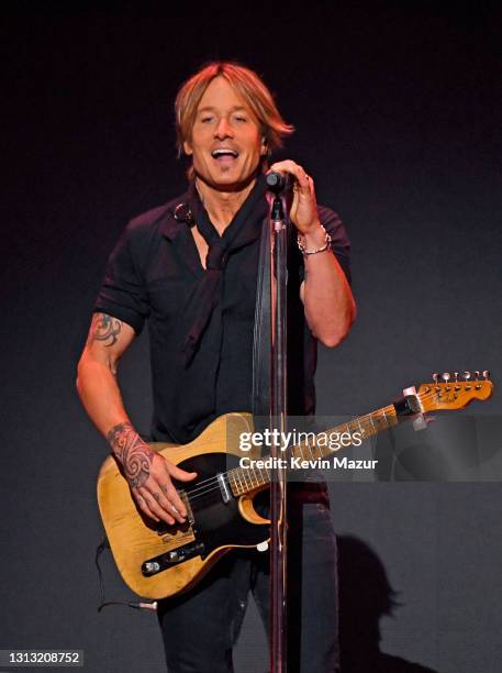 In this image released on April 18, Keith Urban performs onstage at the 56th Academy of Country Music Awards at the Grand Ole Opry on April 18, 2021...