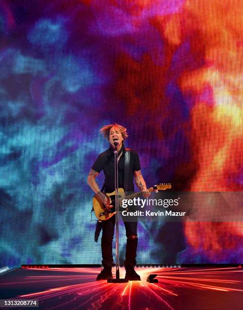 In this image released on April 18, Keith Urban performs onstage at the 56th Academy of Country Music Awards at the Grand Ole Opry on April 18, 2021...