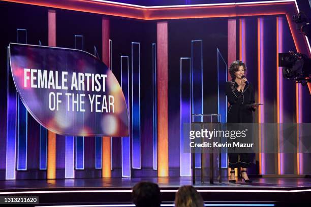 In this image released on April 18, Amy Grant speaks onstage at the 56th Academy of Country Music Awards at the Grand Ole Opry on April 18, 2021 in...