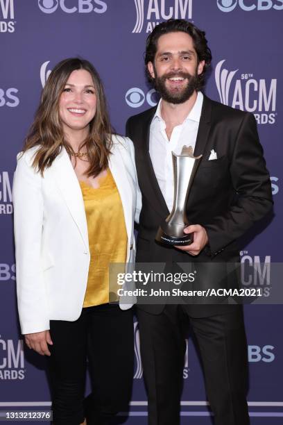 In this image released on April 18, Virginia Bunetta and Thomas Rhett, winner of the award for Male Artist of the Year, attend the 56th Academy of...