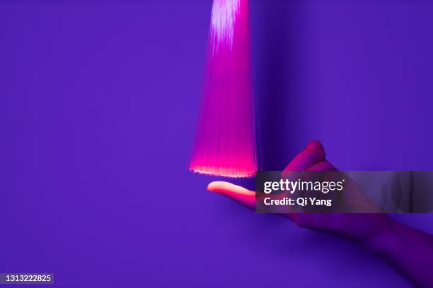 hand touching red optical fiber - augmented reality marketing stock pictures, royalty-free photos & images