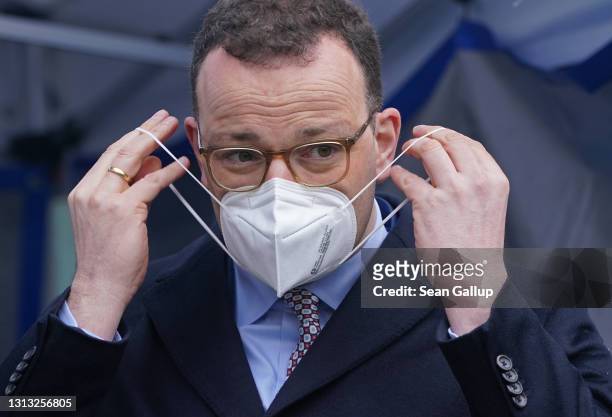 German Health Minister Jens Spahn speaks at the opening of a Covid testing station operated by German drugstore chain DM at the Mall of Berlin...