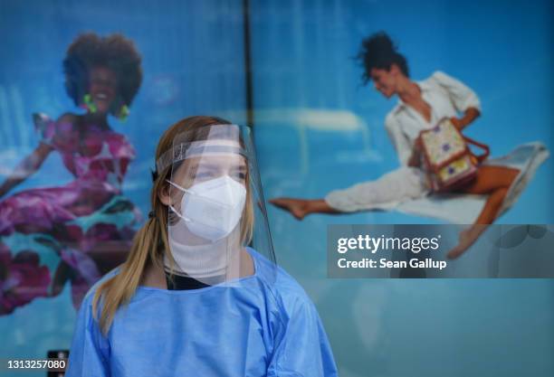 Medical worker attends the opening of a Covid testing station operated by German drugstore chain DM at a press event at the Mall of Berlin shopping...