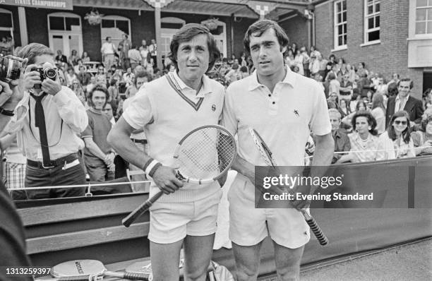 Romanian tennis player Ilie Nastase and British tennis player Roger Taylor reach the final of the Men's Singles at the Queen's Club Championships in...