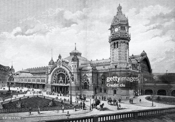 cologne railway station, seen from the cathedral terrace - railway station stock illustrations