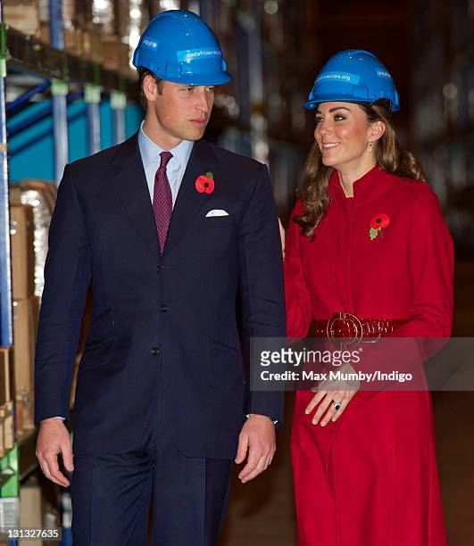 Prince William, Duke of Cambridge and Catherine, Duchess of Cambridge wear hard hats as they visit the UNICEF emergency supply centre on November 2,...