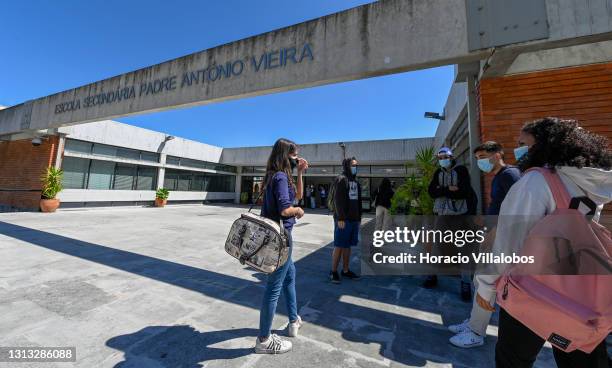 High school students stand in the front yard during the visit by Portuguese President Marcelo Rebelo de Sousa accompanied by the Minister of...