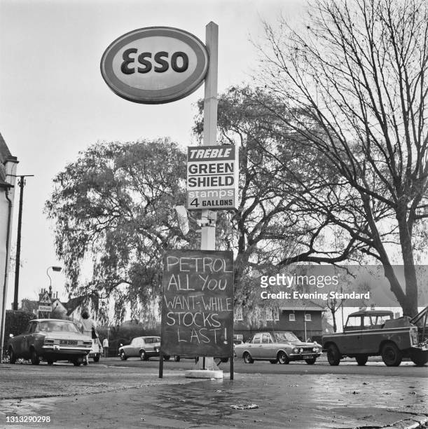Sign reading 'Petrol - All You Want While Stocks Last!' at an Esso petrol station on Kensington Avenue, Thornton Heath, London, during the 1973 oil...
