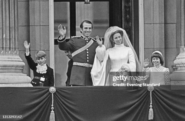 Princess Anne and Mark Phillips wave to the crowds from the balcony of Buckingham Palace in London, UK, on their wedding day, 14th November 1973. On...