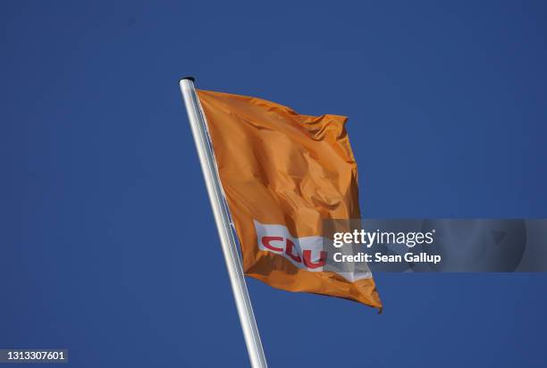 Flag flies over the party headquarters of the German Christian Democrats on April 19, 2021 in Berlin, Germany. The party leadership is scheduled to...