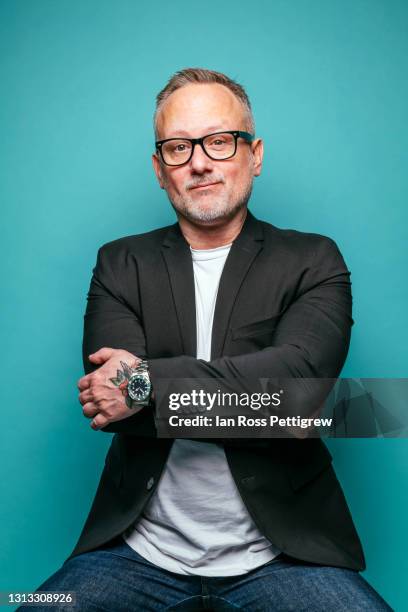 middle-aged businessman, arms crossed - man coloured background stock pictures, royalty-free photos & images