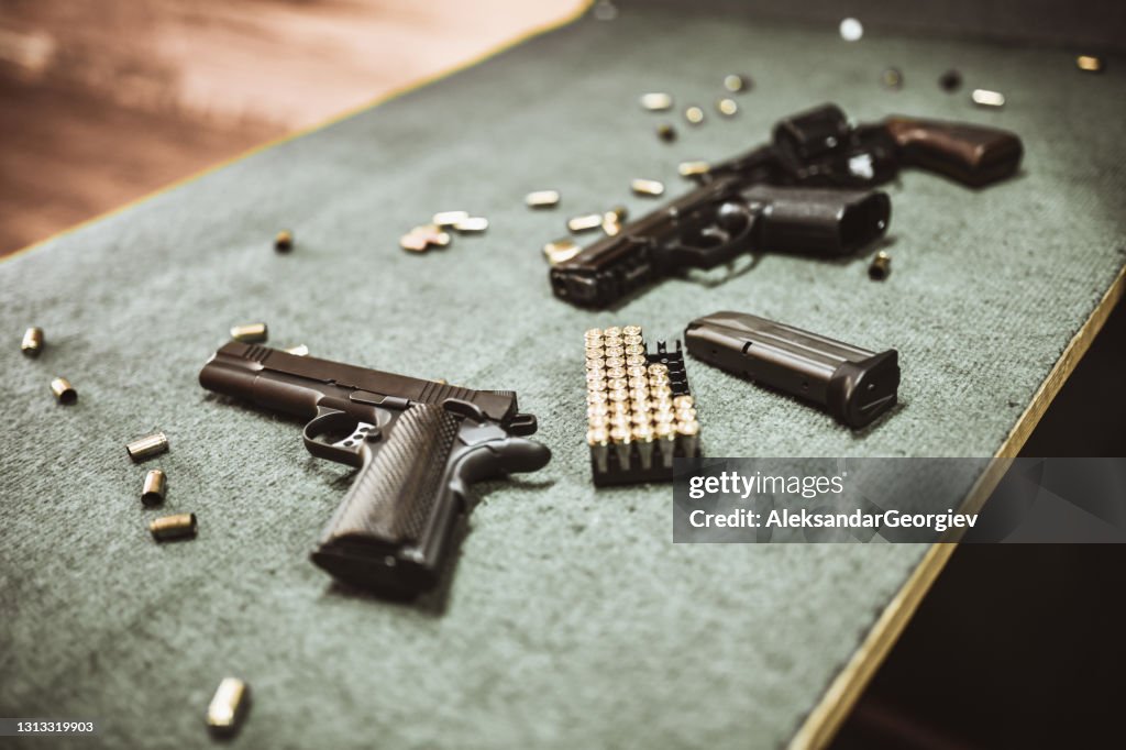 Modern Pistols And Gun Cartridges At Gun Training Range