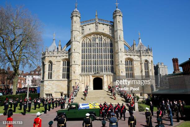 Prince Philip, Duke of Edinburgh's coffin is carried on a specially designed Land Rover Defender hearse to his funeral service at St. George's...