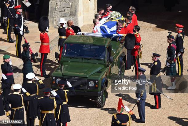 Bearer Party of Grenadier Guards place Prince Philip, Duke of Edinburgh's coffin onto a specially designed Land Rover Defender hearse during his...