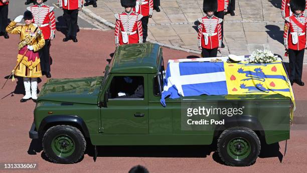 Prince Philip, Duke of Edinburgh's coffin is carried on a specially designed Land Rover Defender hearse during his funeral procession to St. George's...