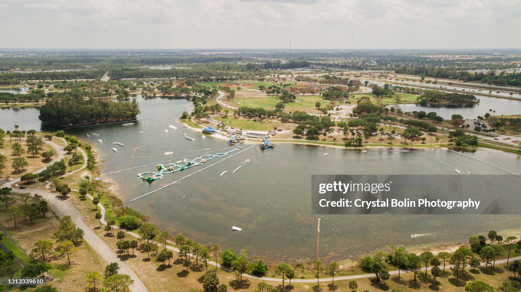 Aerial View of a Blue Sky Over Lake Water and a Green Lush Park in Central West Palm Beach, Florida During COVID-19 in April of 2021