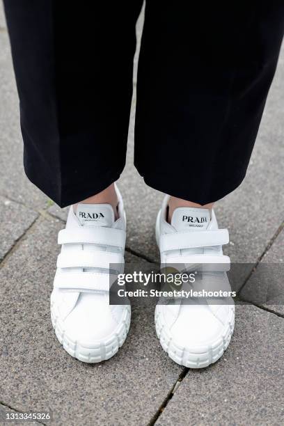 White velcro sneaker by Prada as a detail of Influencer Maria Barteczko during a street style shooting on April 19, 2021 in Duesseldorf, Germany.
