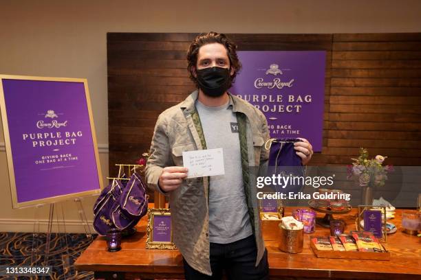 In this image released on April 18, Thomas Rhett is seen at Crown Royal Purple Bag Project packing a bag to be sent to a military hero at the 56th...