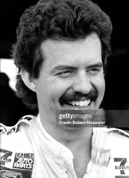 Driver Kyle Petty relaxes in the speedway garage area prior to the start of the 1985 Daytona 500 stock car race at Daytona International Speedway in...