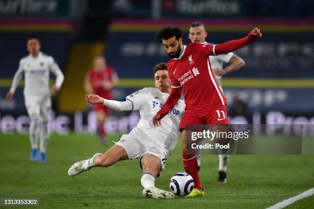 Mohamed Salah of Liverpool is challenged by Diego Llorente of Leeds United during the Premier League match between Leeds United and Liverpool at...