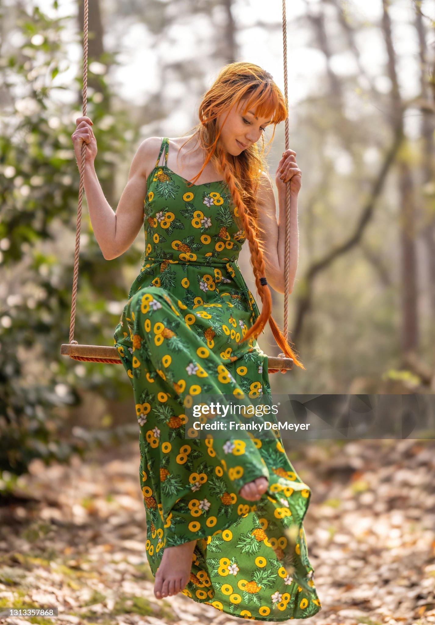 https://media.gettyimages.com/id/1313357868/photo/bashful-beautiful-young-woman-in-the-public-parc-woods-swinging-on-a-rope-swing-wearing-a.jpg?s=2048x2048&amp;w=gi&amp;k=20&amp;c=tF3qPrsJ3fK7dNJWVwB-QFWg6OCYuA3Kk4RTj8IwRro=