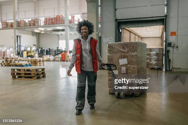 african - american working in the warehouse - pallet jack stock pictures, royalty-free photos & images