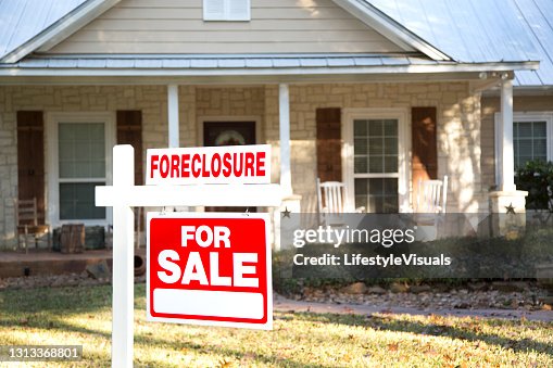 Home for sale with real estate sign. Front Yard. Home for sale with real estate sign. Front Yard.