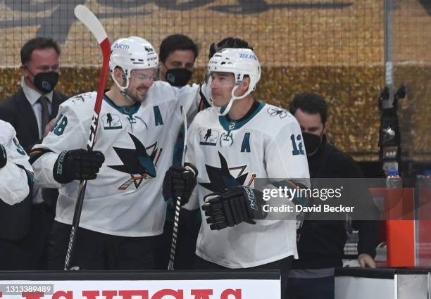 Patrick Marleau of the San Jose Sharks is honored after breaking Gordie Howe's record for most games played after his first shift during the first...