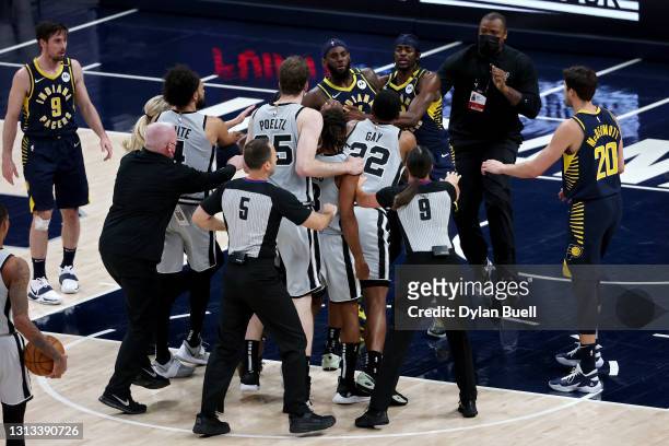The San Antonio Spurs and Indiana Pacers confront each other in the fourth quarter at Bankers Life Fieldhouse on April 19, 2021 in Indianapolis,...