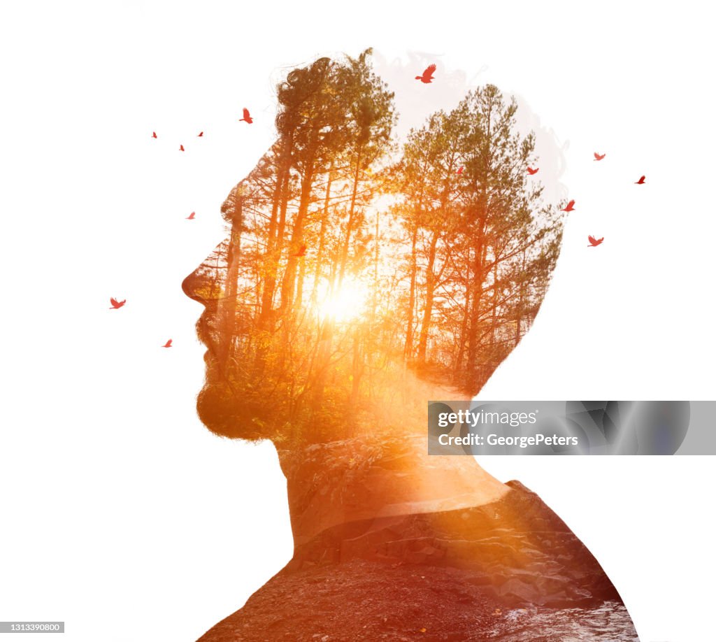 Multiple Exposure of young man and nature